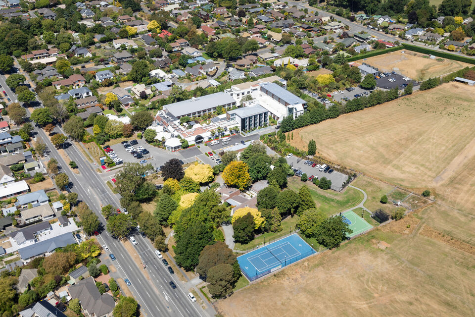 Tennis court shot: Love active family holidays? Christchurch hotel The Commodore offers a tennis court, basketball hoop and pickleball courts – just the answer to shake off the fatigue of a long trip.