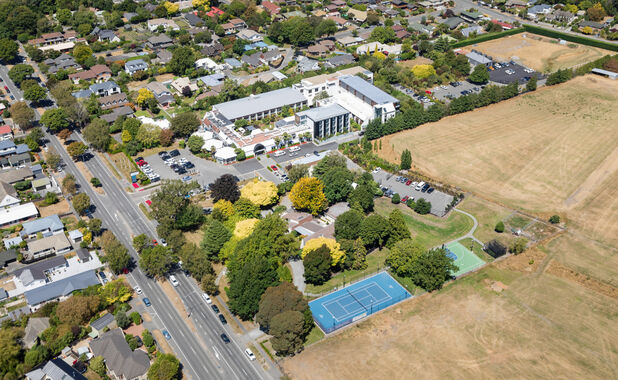 Tennis court shot: Love active family holidays? Christchurch hotel The Commodore offers a tennis court, basketball hoop and pickleball courts – just the answer to shake off the fatigue of a long trip.